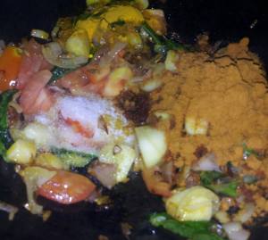 tomato and masala while sautéing 